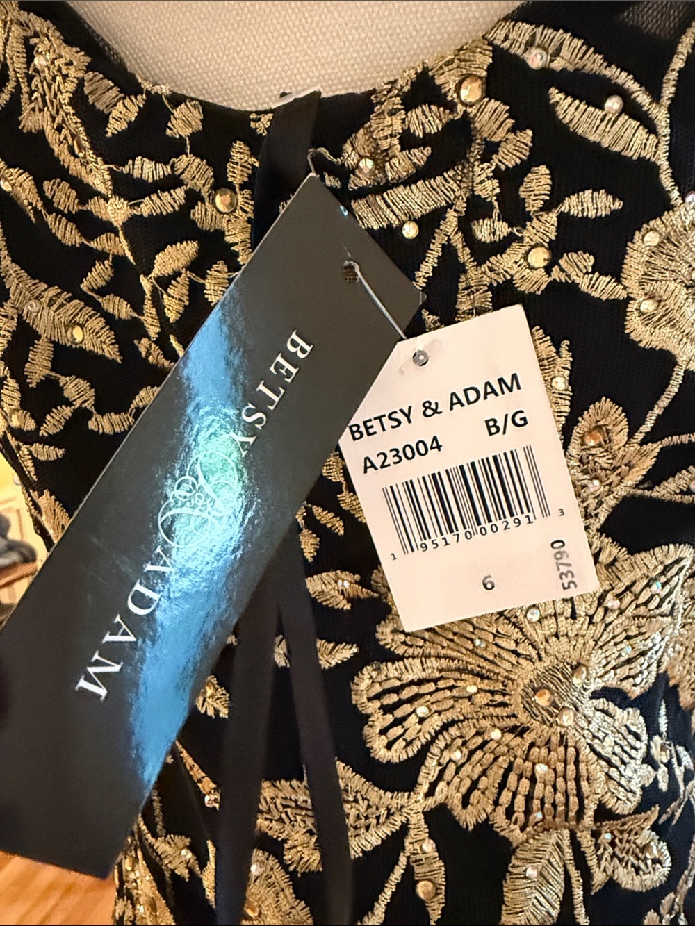 Betsy & AdamElegant Black Halter Evening Gown with Gold Floral Embroidery - Picture 2 of 5